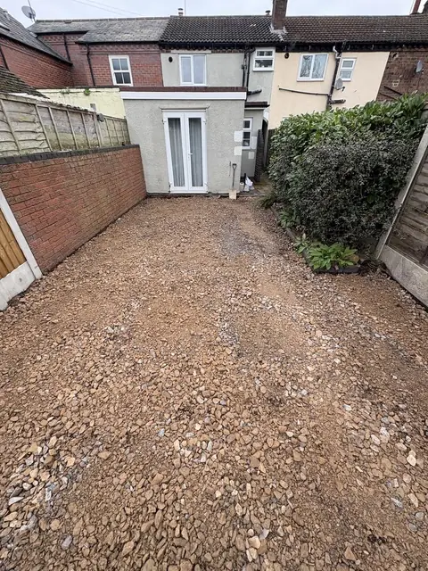 A driveway dug out with the sub-base laid ready for paving