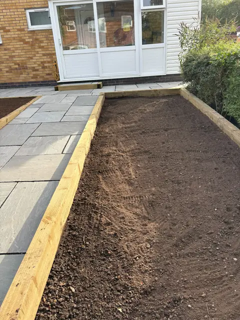 Ground cleared and edged in timber, ready for topsoil and turf
